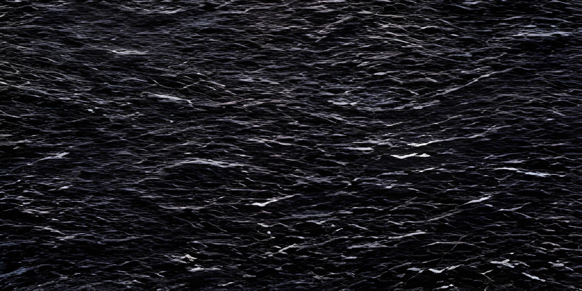 black brick wall of dark stone texture and background, stone floor wide picture photo