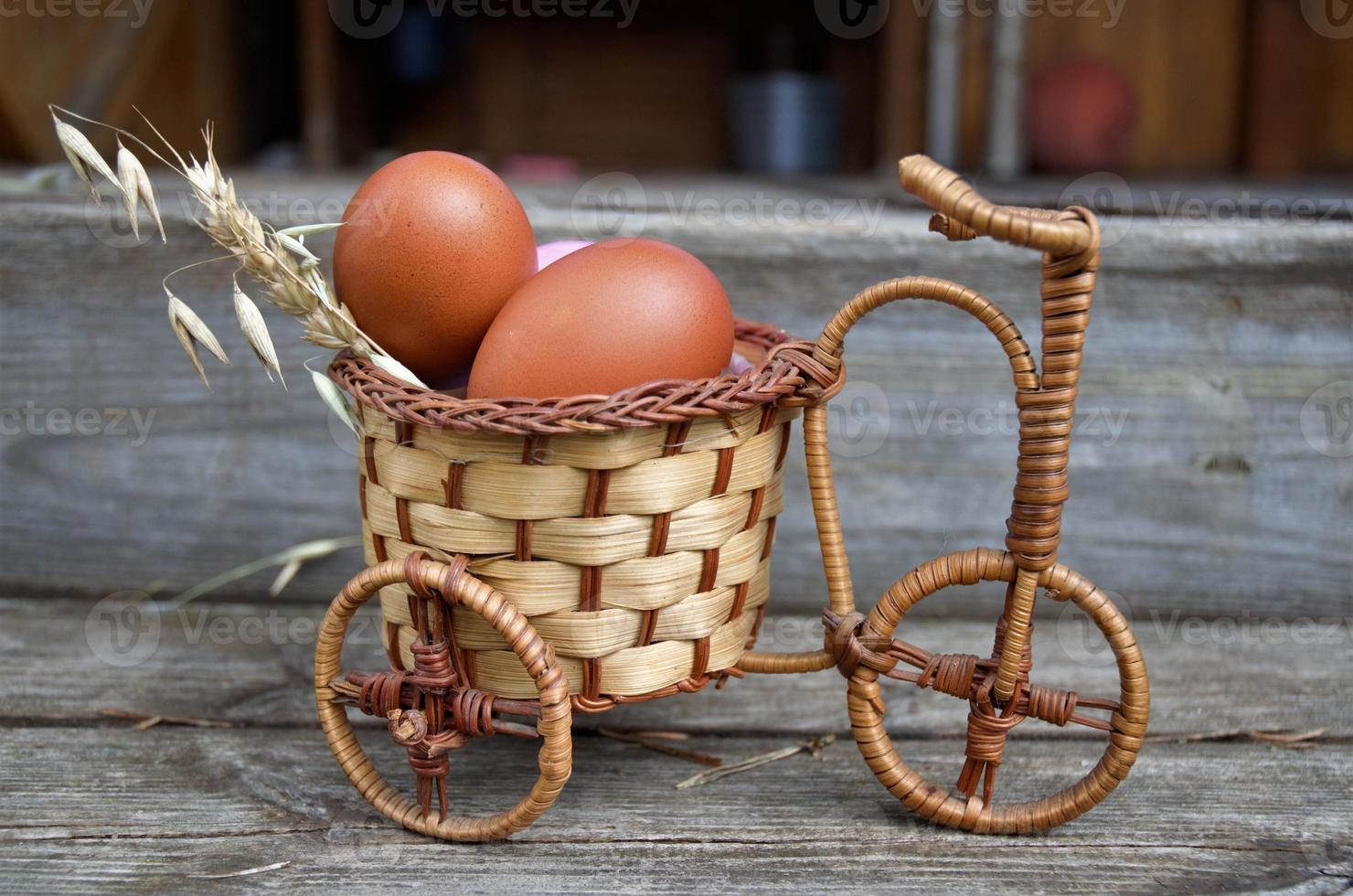 chicken eggs in a wicker basket, The concept of Easter photo