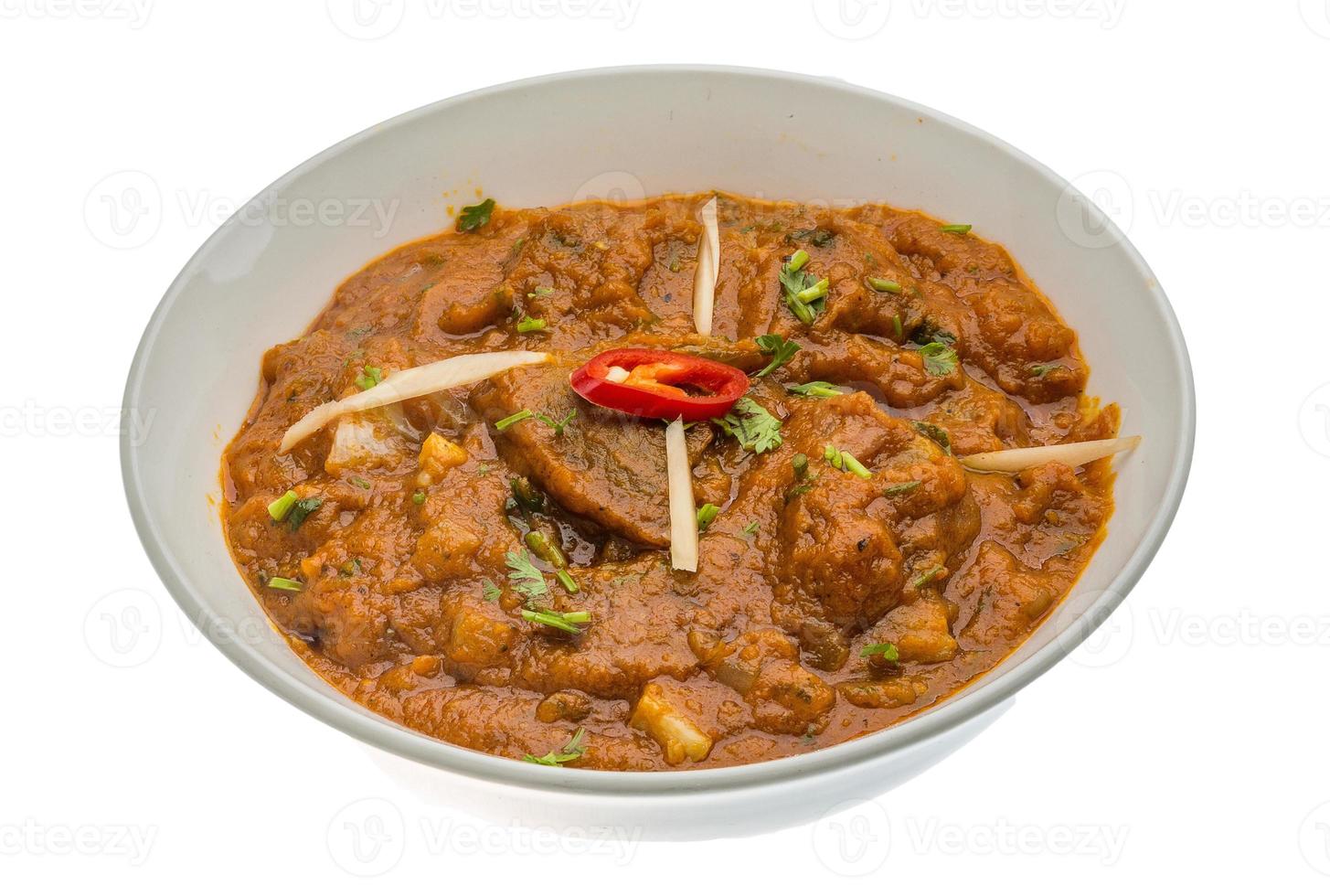 Lamb vindaloo in a bowl on white background photo