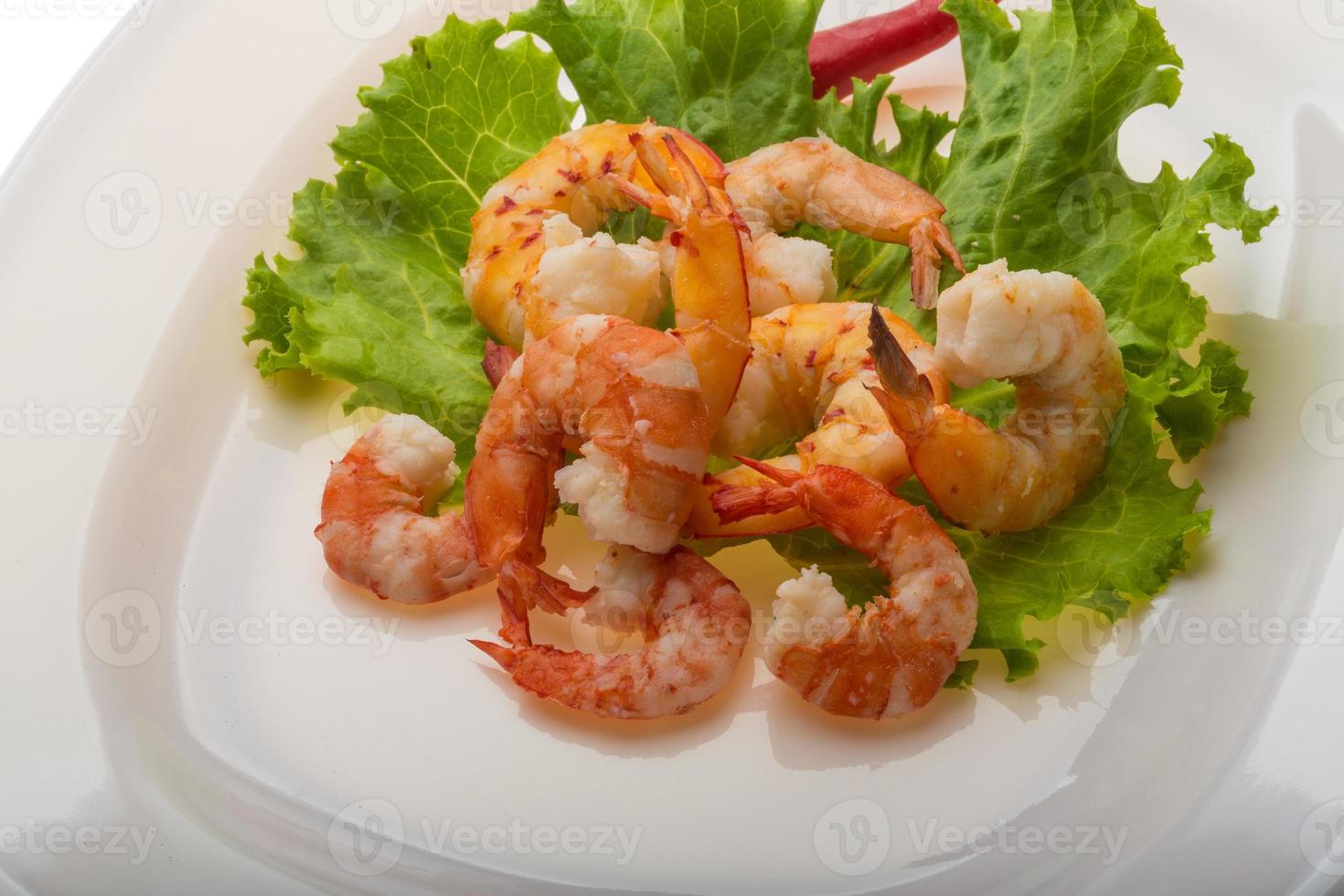 Unshelled king prawn on the plate photo