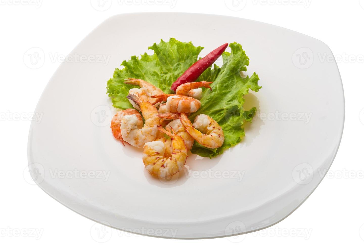 Unshelled king prawn on the plate and white background photo