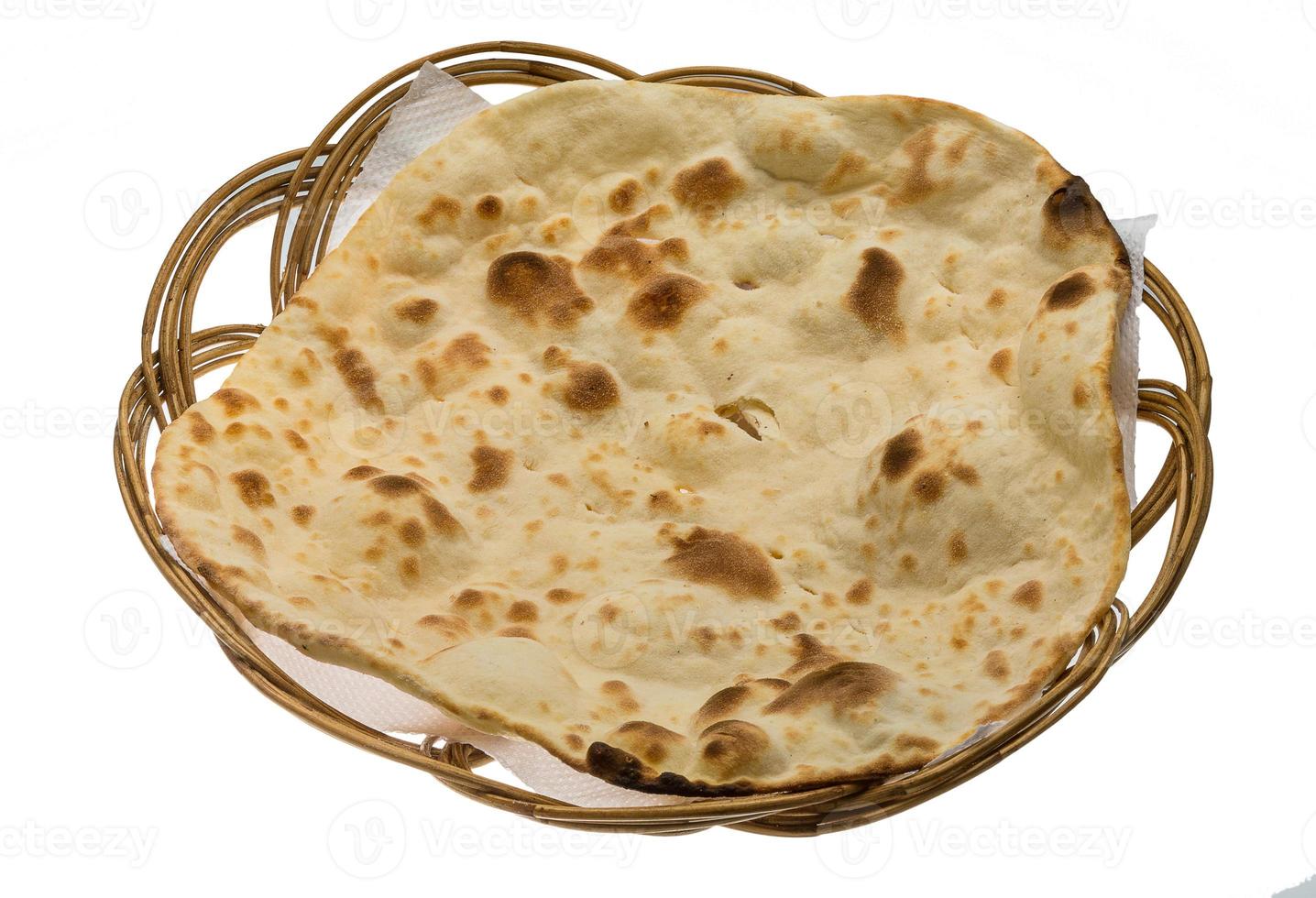 Plain Naan in a basket on white background photo