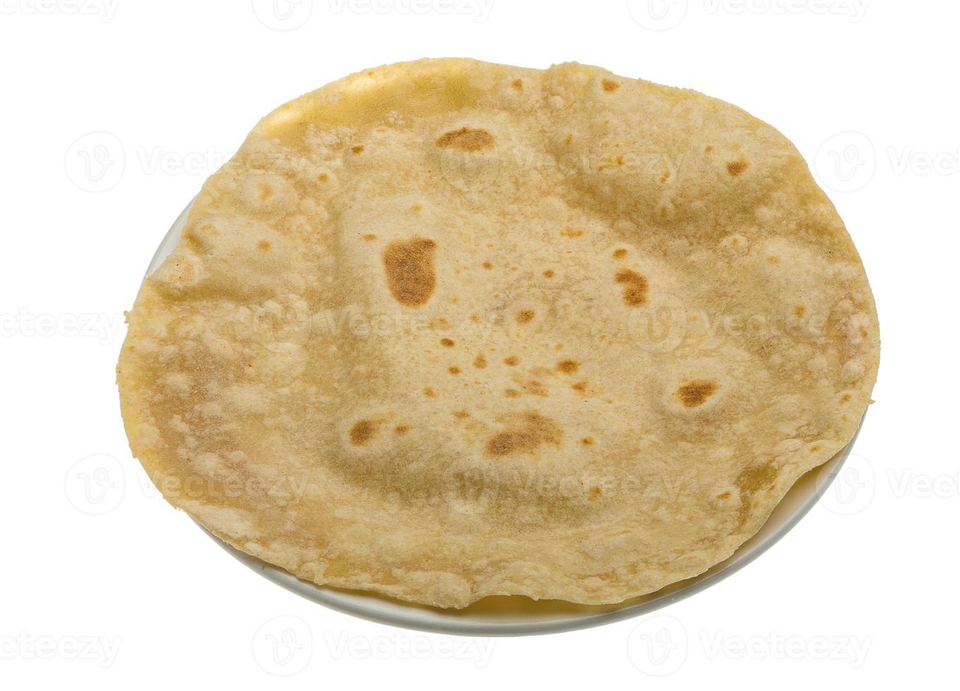 Chapati in a basket on white background photo