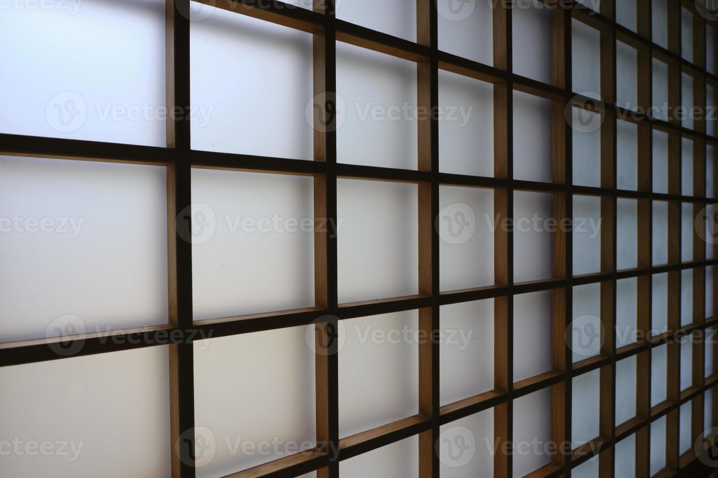 Shoji sliding screen door made of wood and Japanese paper shot from an angle with leading lines photo