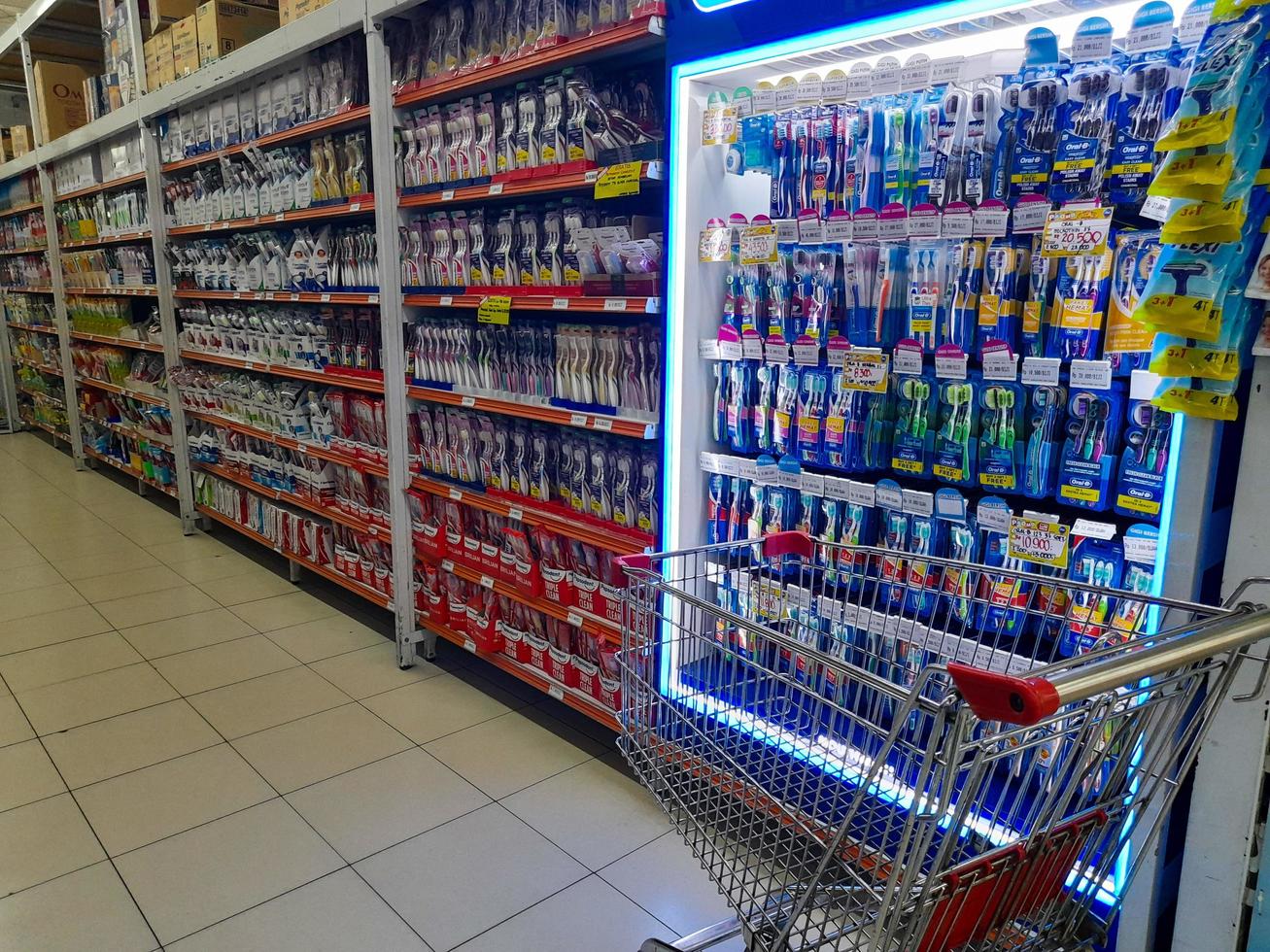 Jombang, East Java, Indonesia, 2022 - Rows of toothbrushes from various well-known brands in Indonesia. portrait of dental care product display in a shopping mall. photo