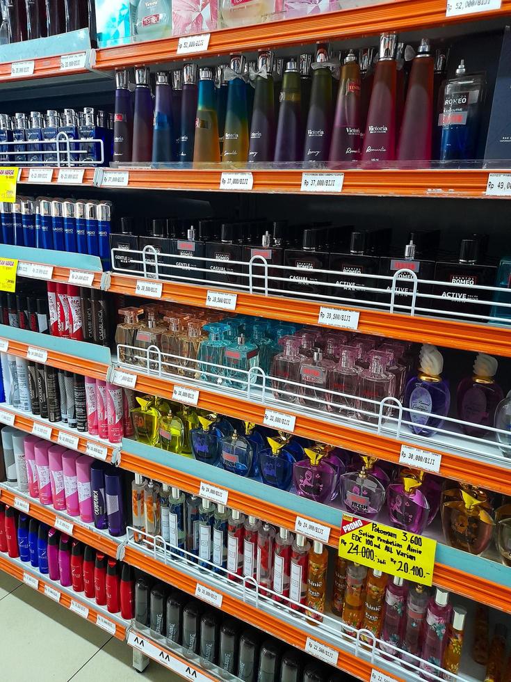 Jombang, East Java, Indonesia, 2022 - Rows of perfume shelves in supermarkets from various well-known brands in Indonesia. portrait of perfume display in shopping mall. photo