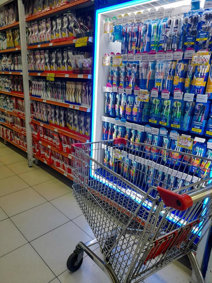 Jombang, East Java, Indonesia, 2022 - Rows of toothbrushes from various well-known brands in Indonesia. portrait of dental care product display in a shopping mall. photo