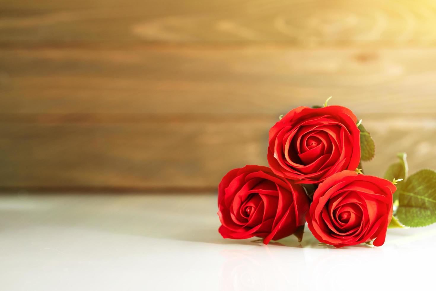 Red roses on table with copy space photo