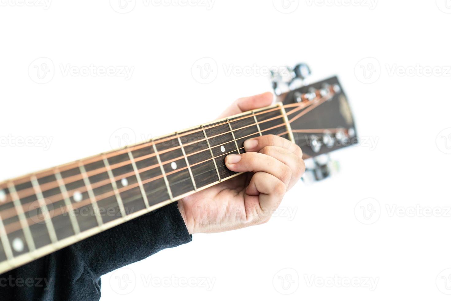 Hands playing guitar on white photo