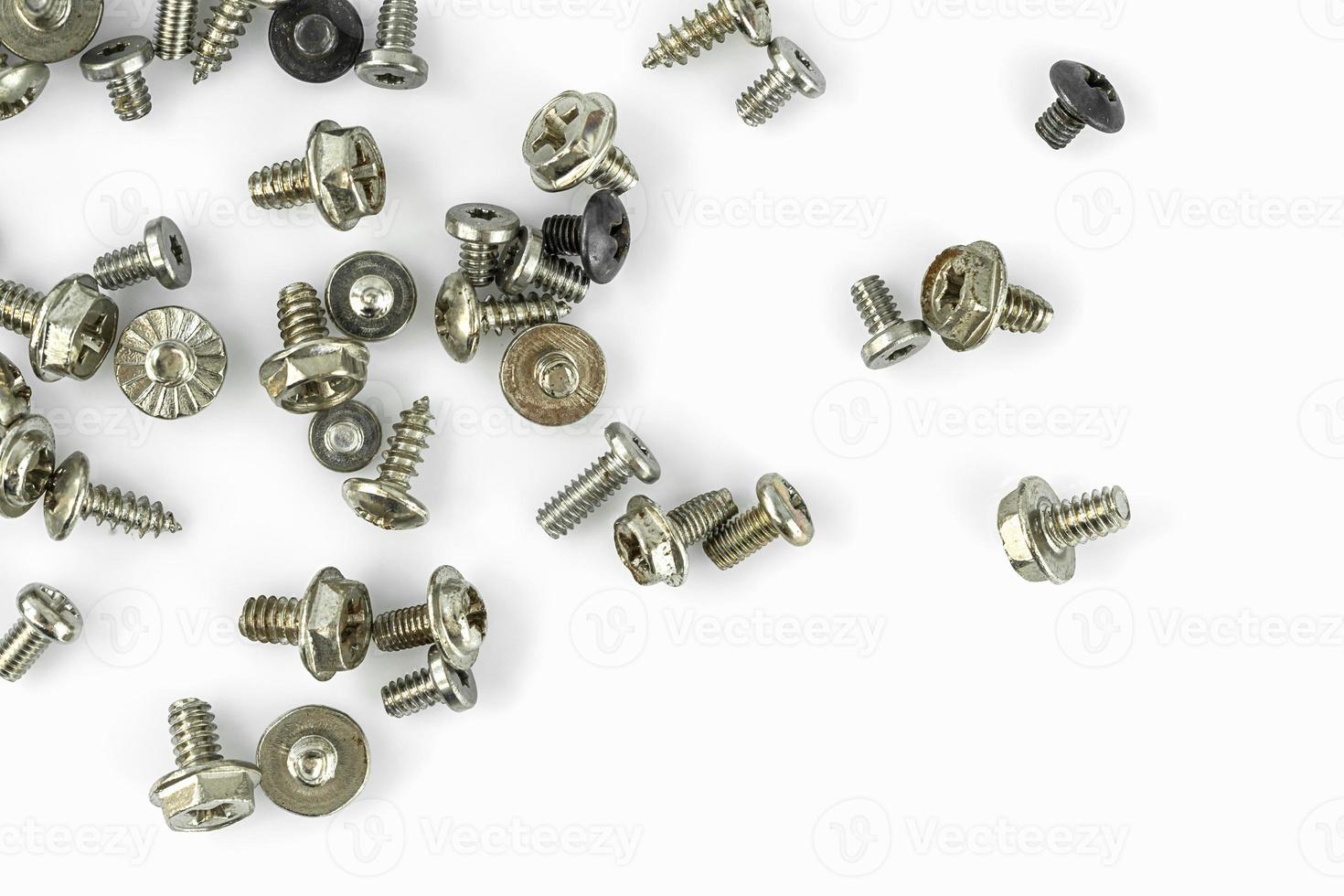 Old screws on the white background photo