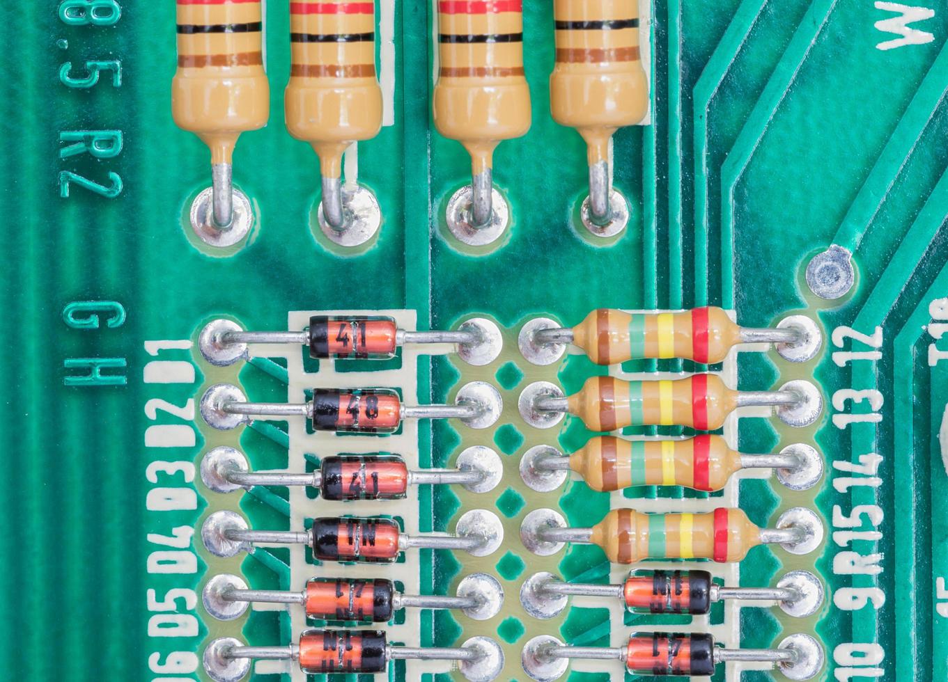 Condensers and Resistor assembly on the circuit board photo