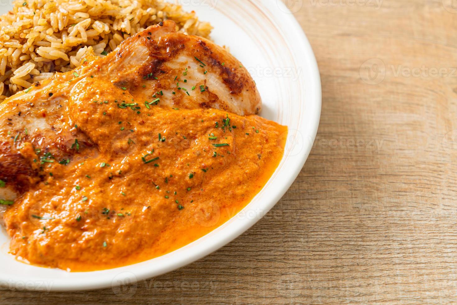 grilled chicken steak with red curry sauce and rice photo