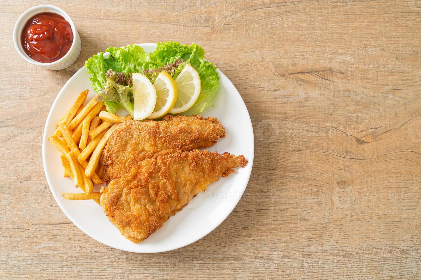 Homemade Breaded Weiner Schnitzel with Potato Chips photo