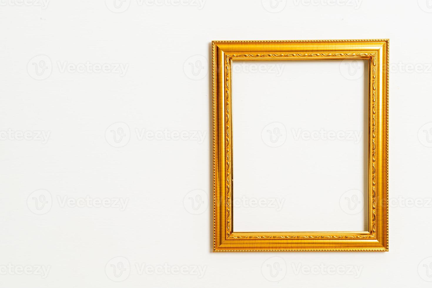 empty picture frame on white wall background photo