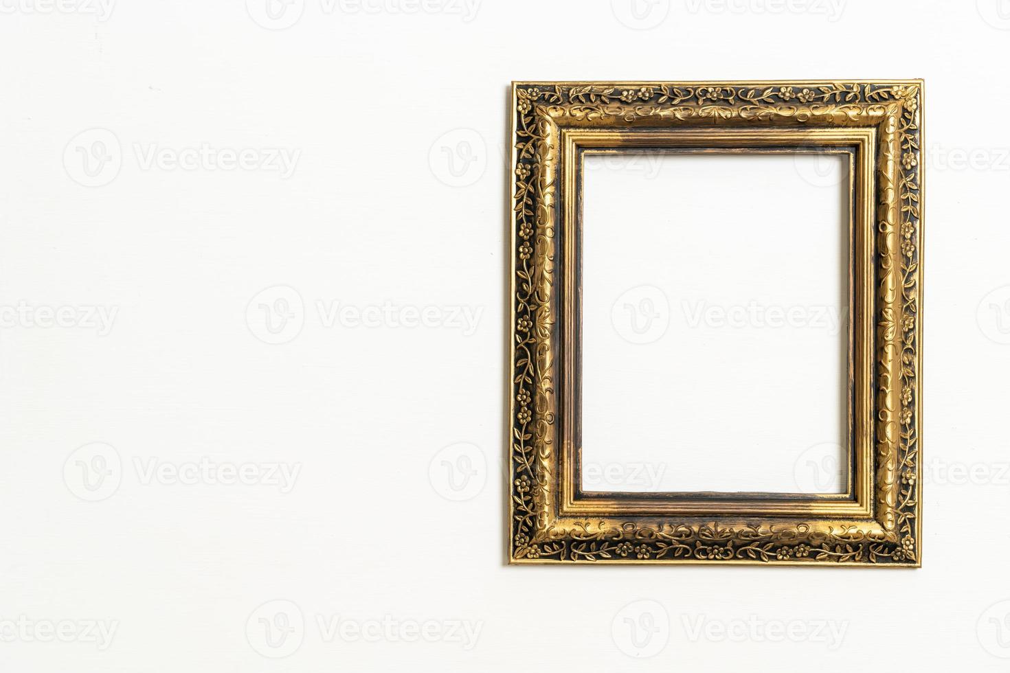 empty picture frame on white wall background photo