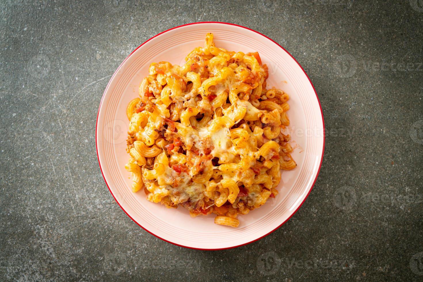 homemade macaroni bolognese with cheese photo