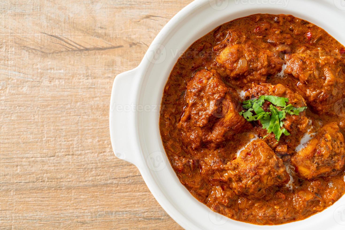 chicken tikka masala spicy curry meat food with roti or naan bread photo