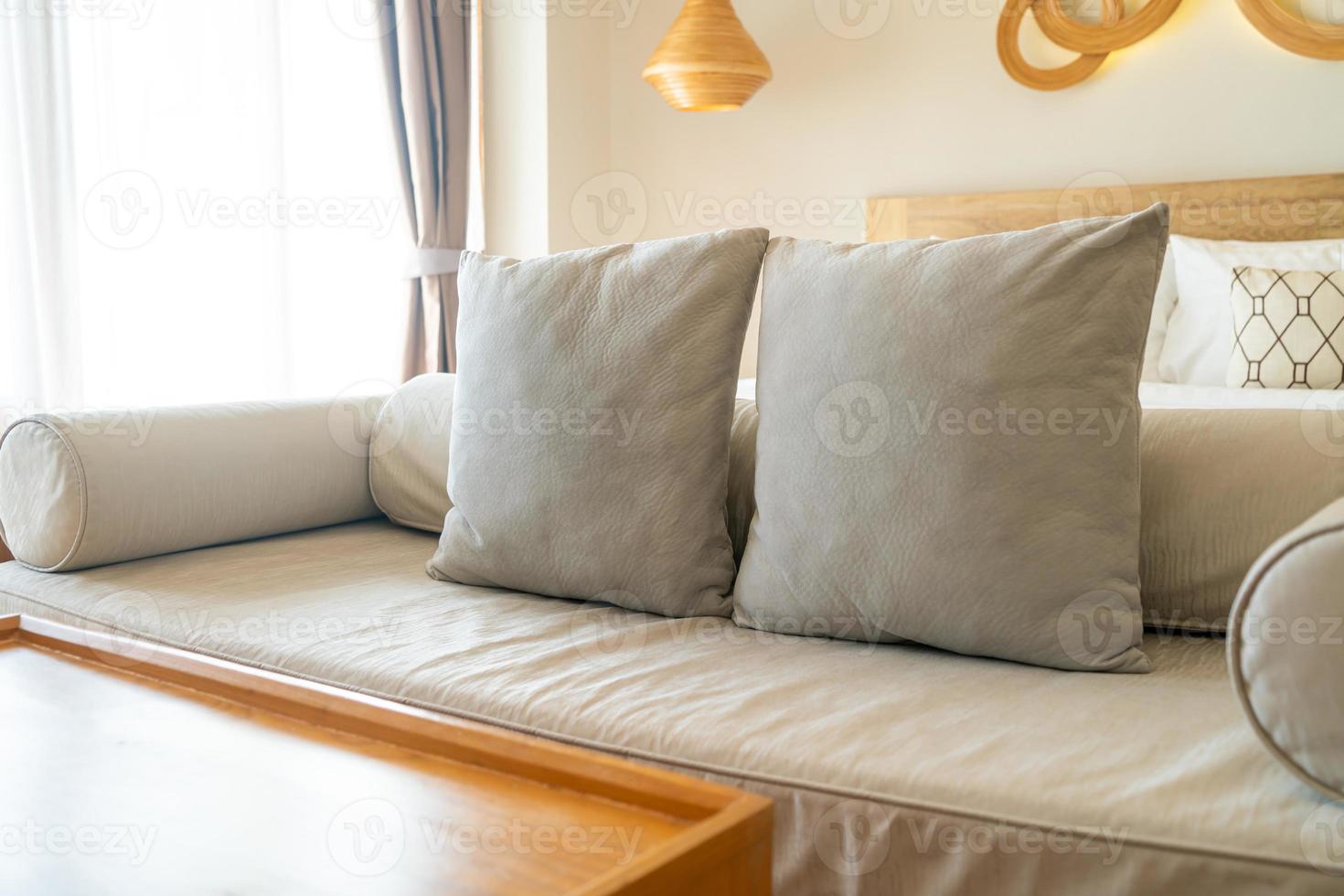 comfortable pillows on end of bed sofa photo