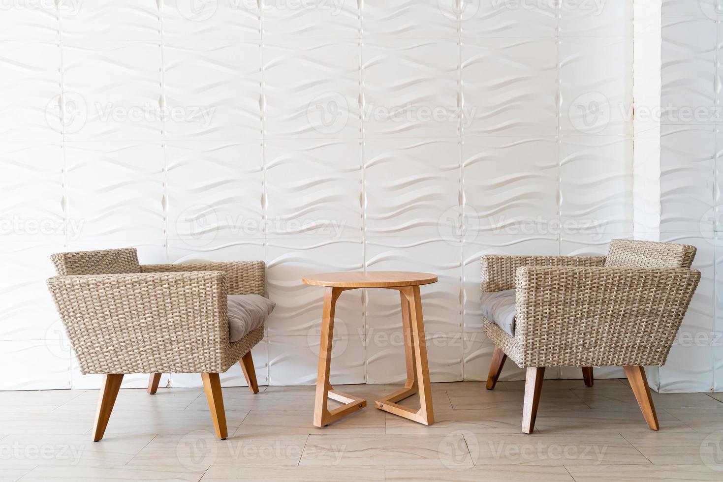 empty wicker sofa with table photo