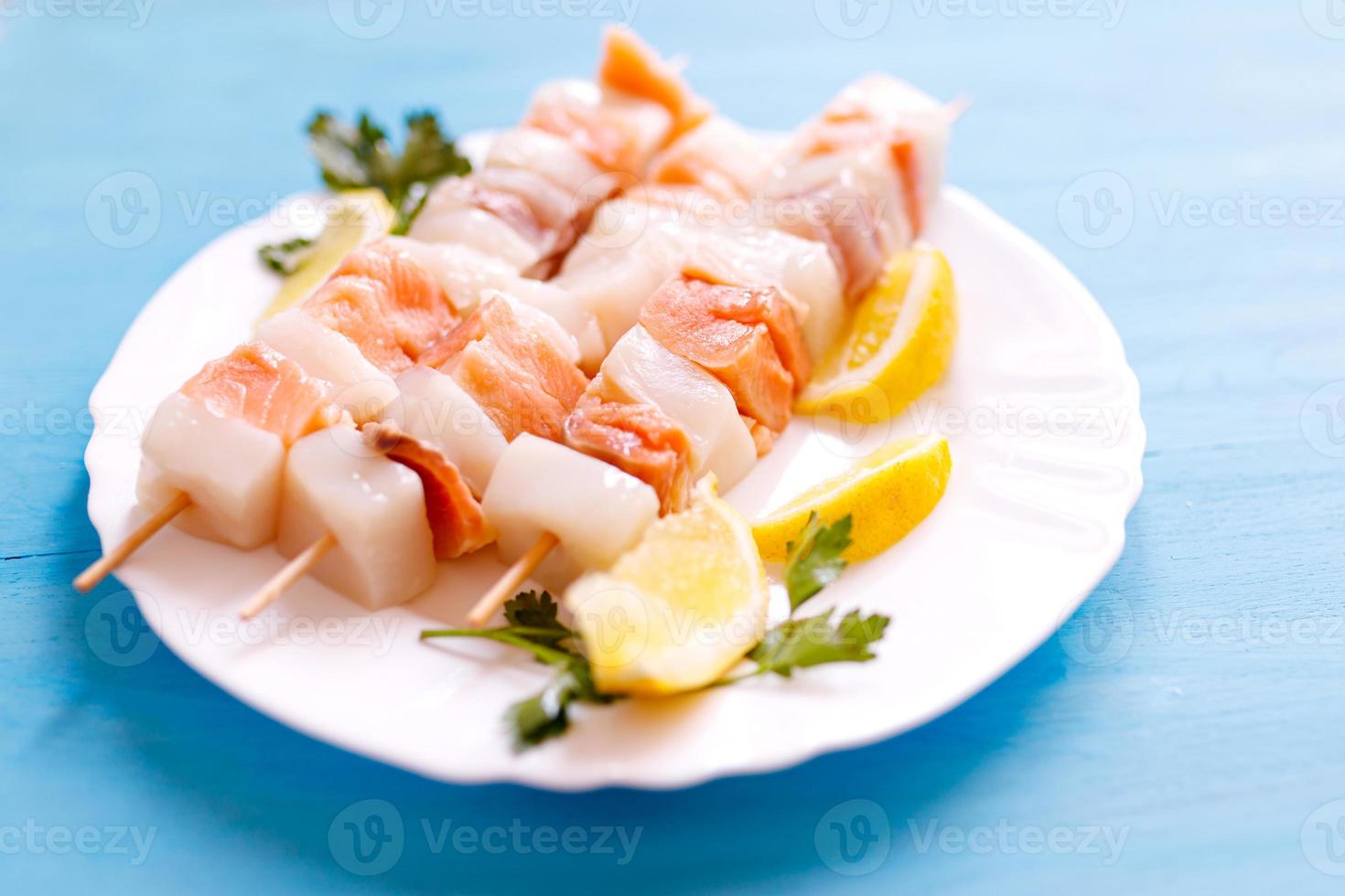 Tasty skewers of fresh fish with vegetables. photo