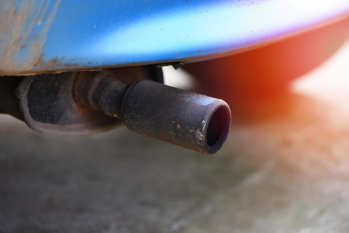 Exhaust pipe on old car close up Car pollution concept photo