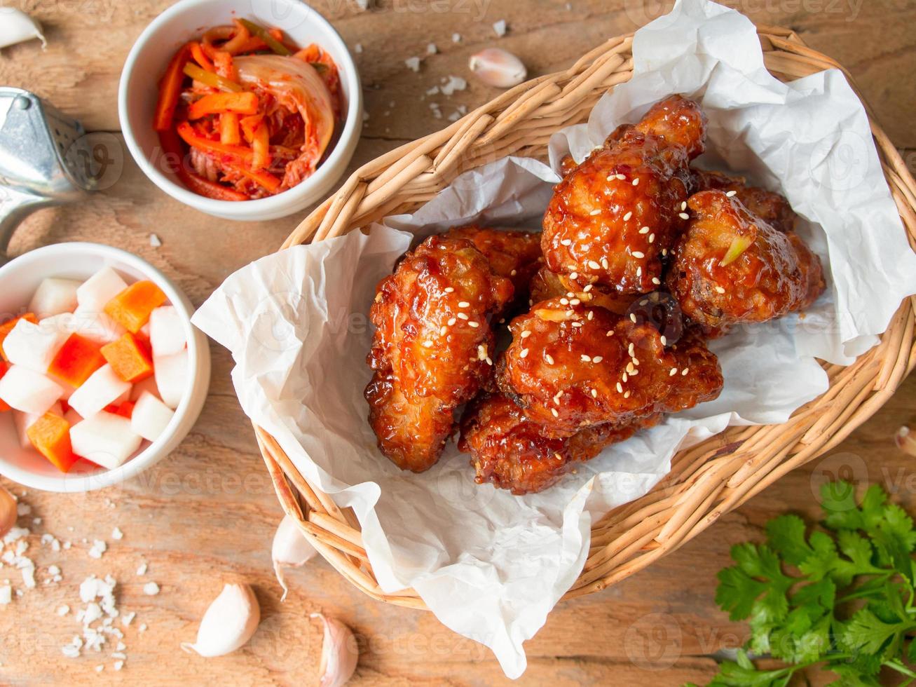 Deep fried chicken wing with garlic sauce in Korean style. photo