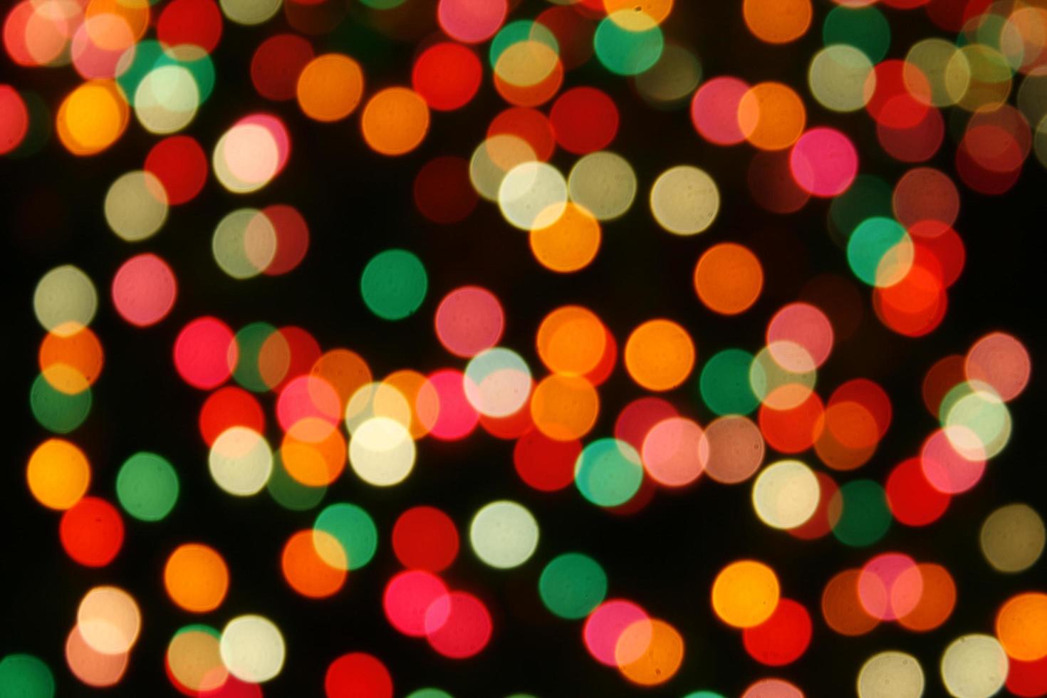 Multicolored defocused bokeh lights background photo