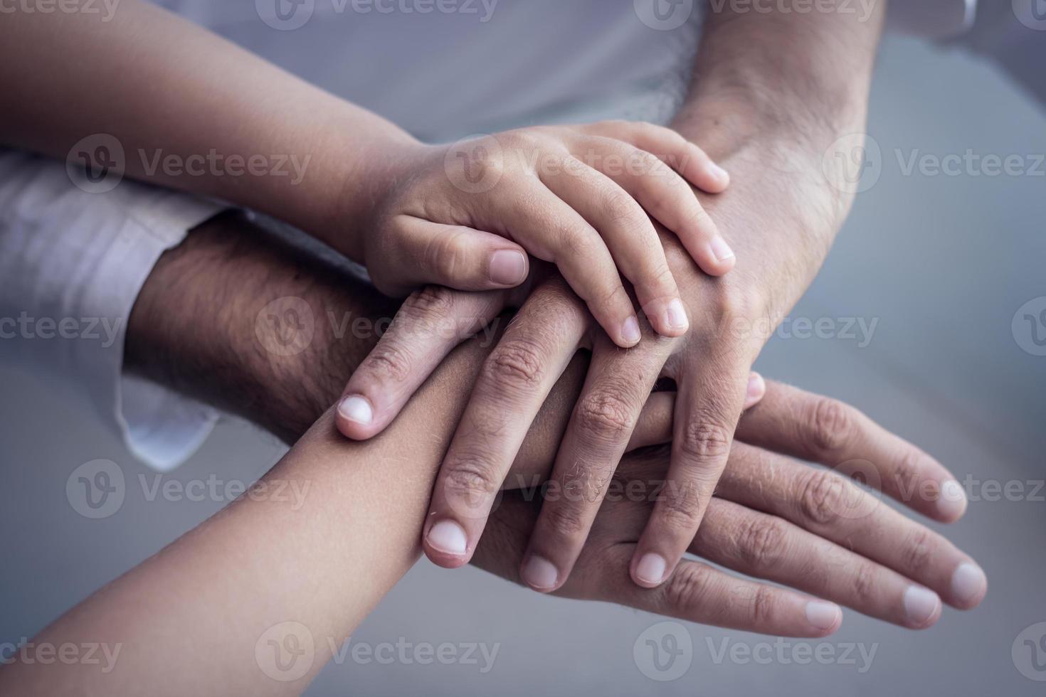 United hands of father and son. photo