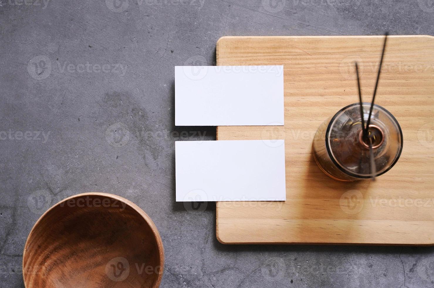 Flat lay branding identity of spa and healthcare business items with blank name card on wooden board, template for design photo