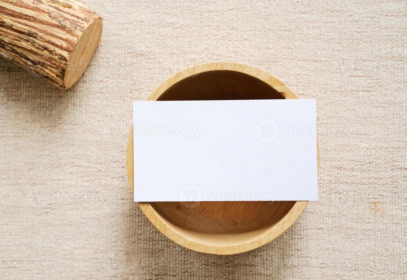 Flat lay of branding identity business name card on wooden container with fabric background, minimal concept for design photo