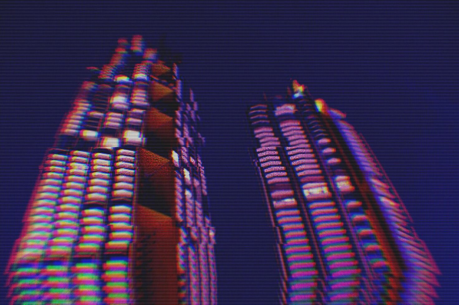 View of modern buildings in the city night background with digital glitch effect photo