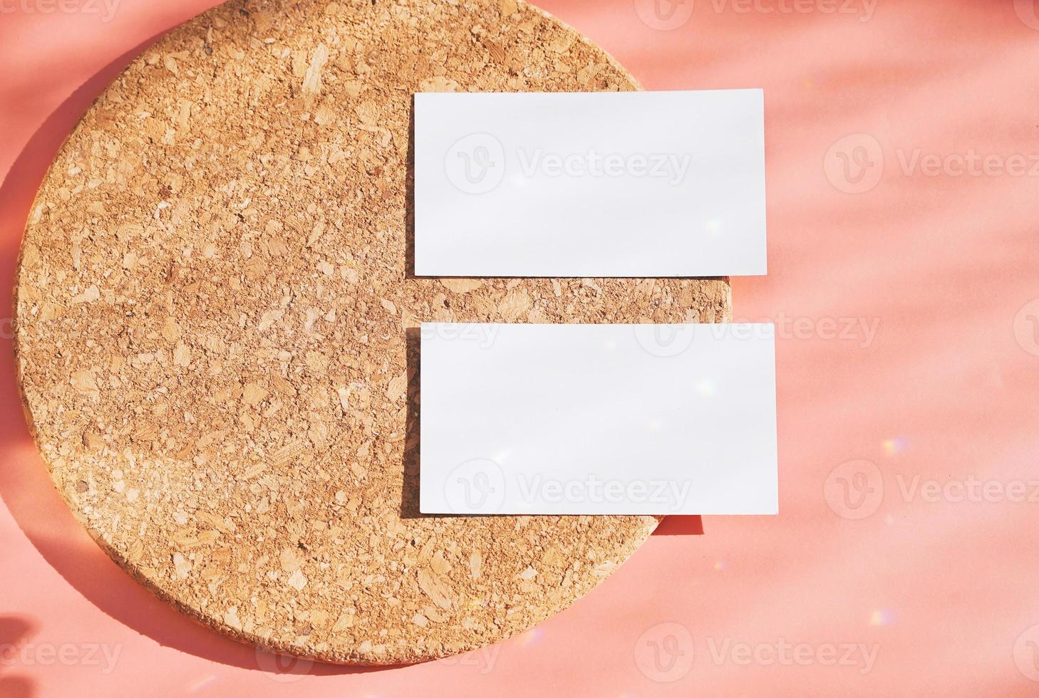 Flat lay of branding identity business name card on wood board and orange background, light and shadow shape with sparkle effect, minimal design photo