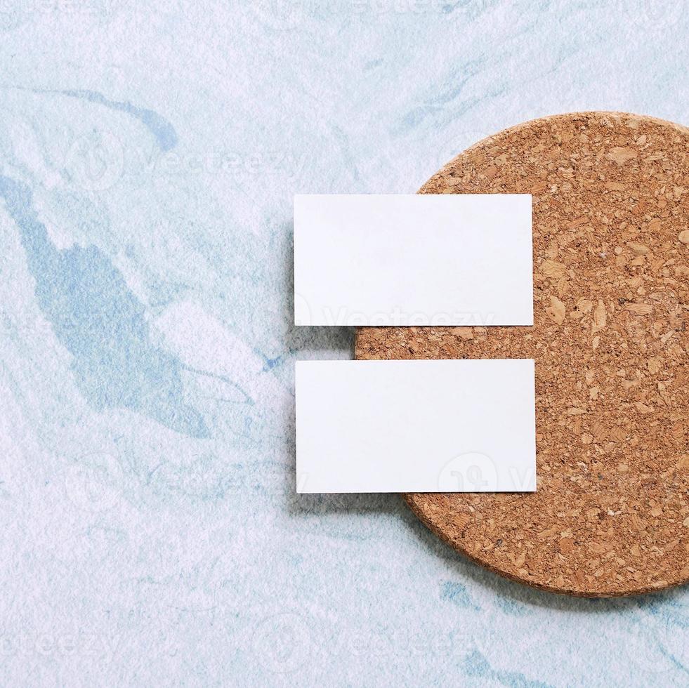 Flat lay of branding identity business name card on wood board and blue marble background, minimal design photo