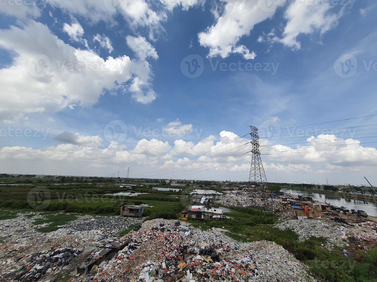 Jakarta, Indonesia in August 2022. An illegal garbage dump on the bank of the East Flood Canal. It causes pollution in the surrounding environment photo