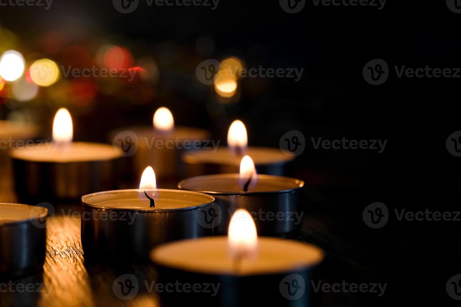 Candle light and bokeh background in the darkness with space for text or image. photo