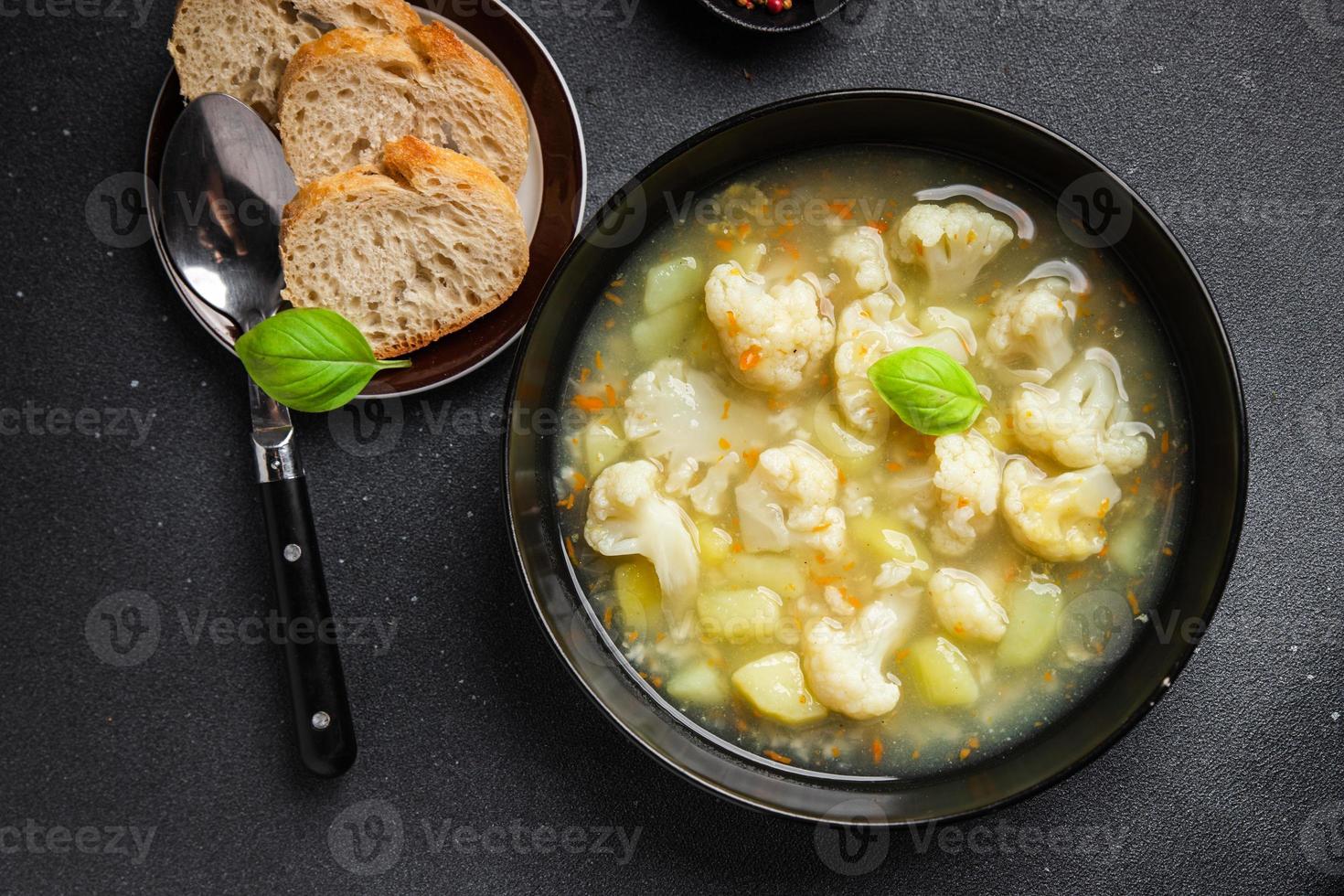 cauliflower soup broth vegetables fresh dish healthy meal food snack diet on the table copy space food background rustic top view keto or paleo diet veggie vegan or vegetarian food photo