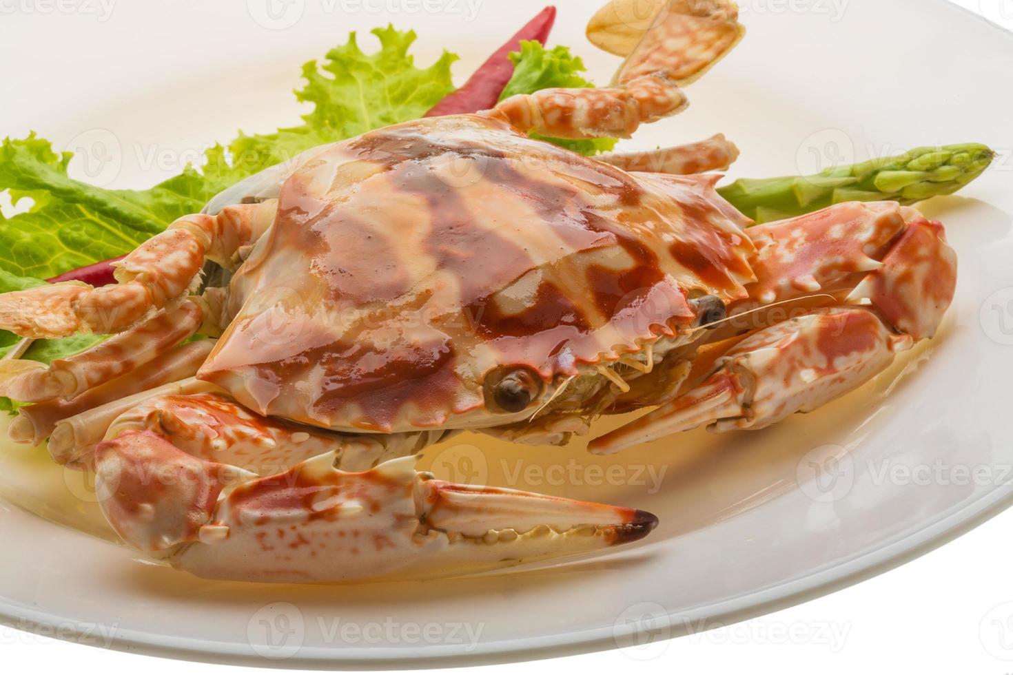 Red crab on the plate and white background photo