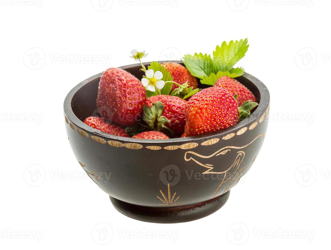 Ripe strawberry in a bowl on white background photo