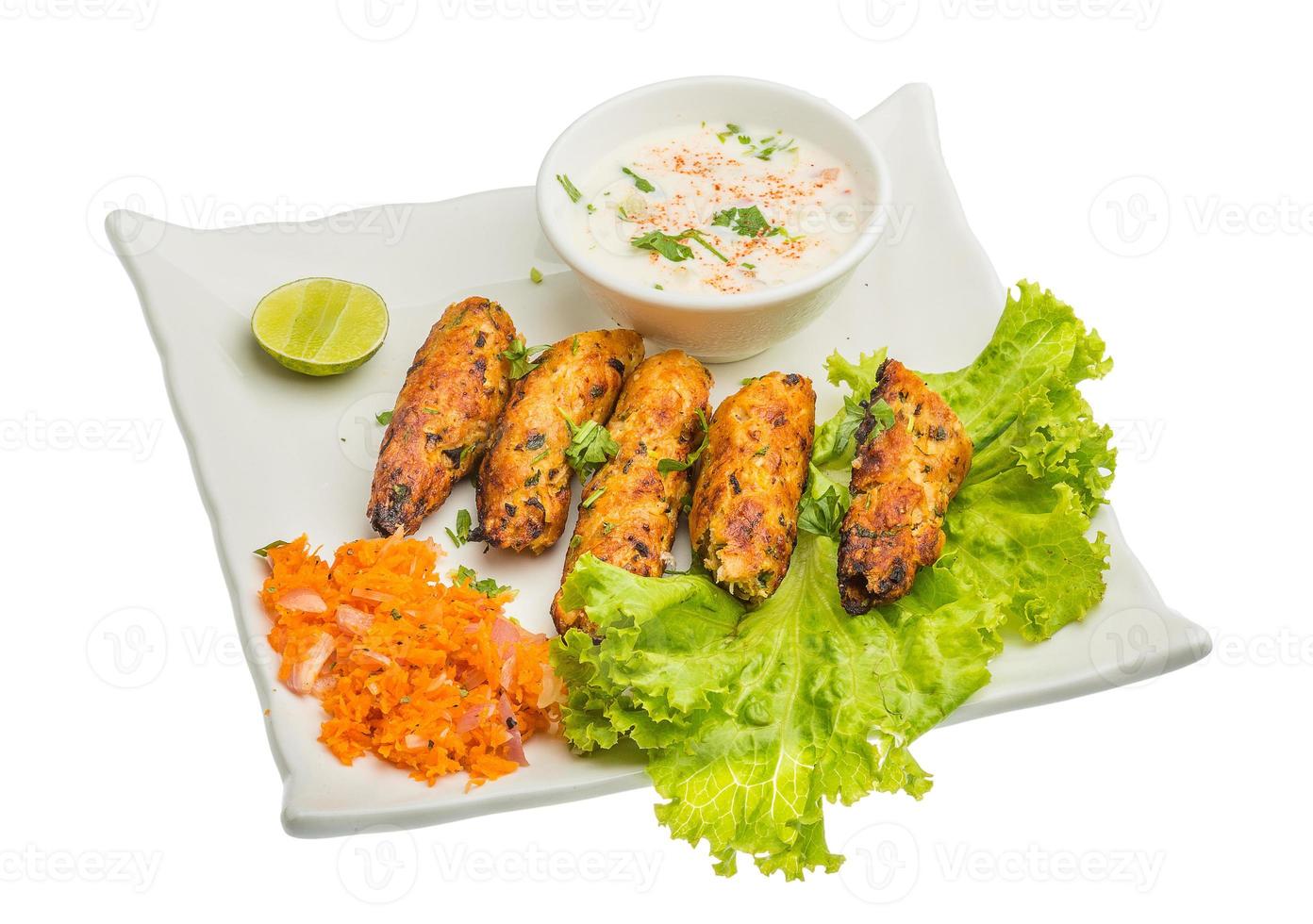 Shish kebab on the plate and white background photo