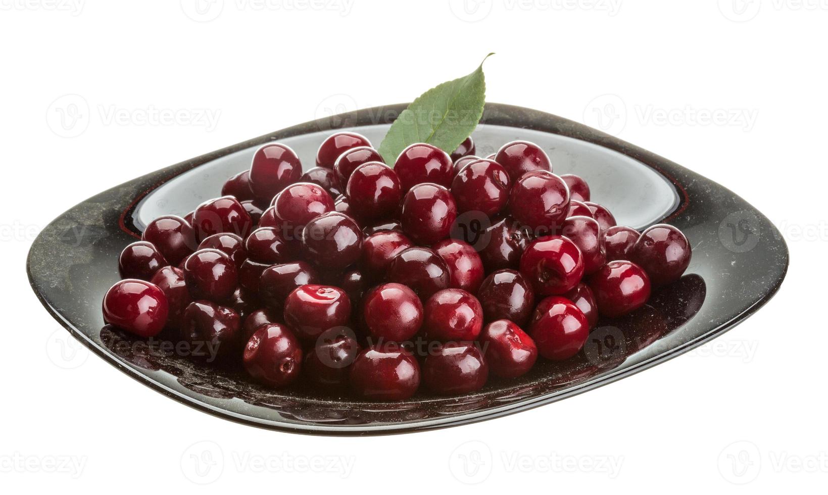 Cherry in the bowl on white background photo