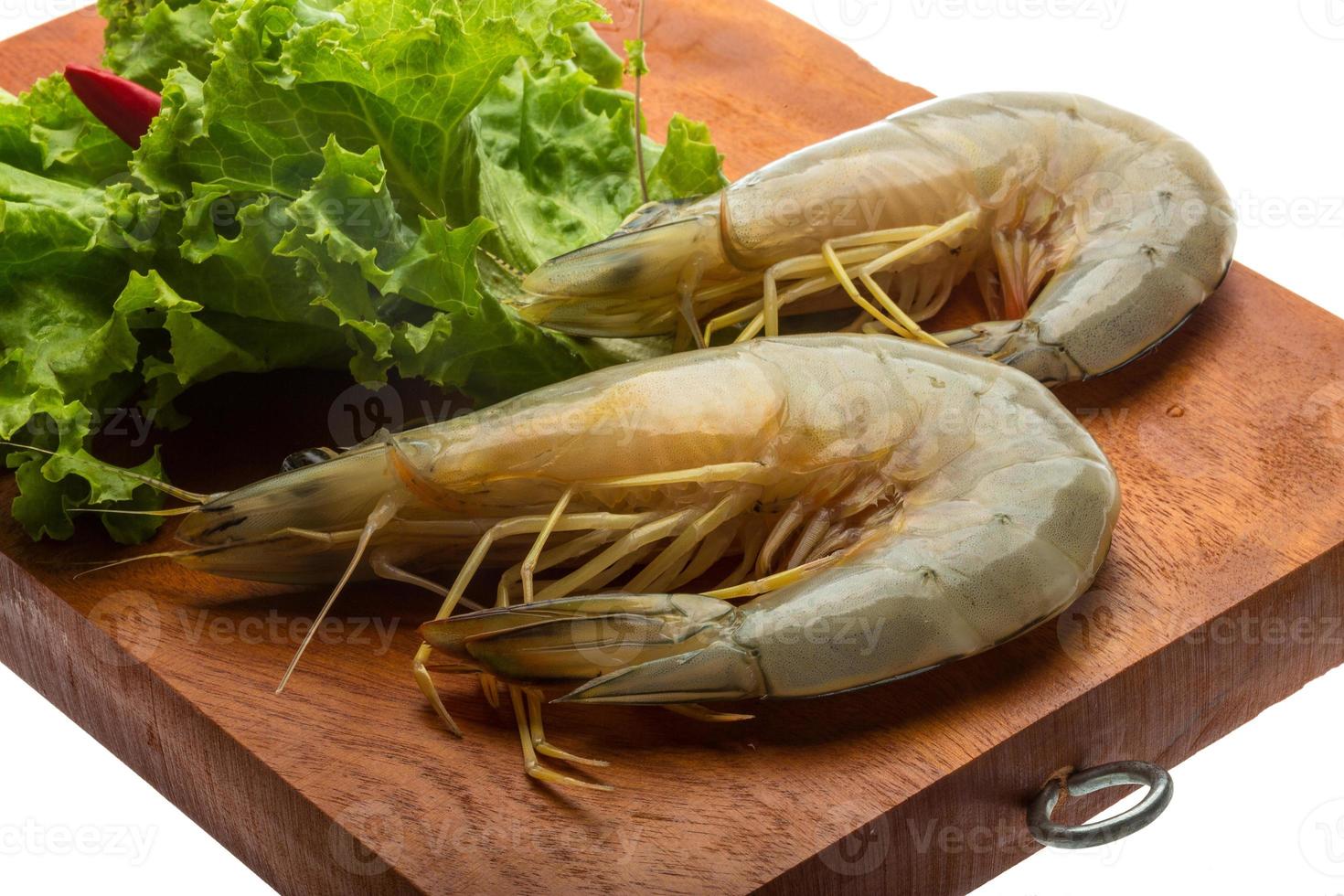 Tiger prawn on wooden board and white background photo