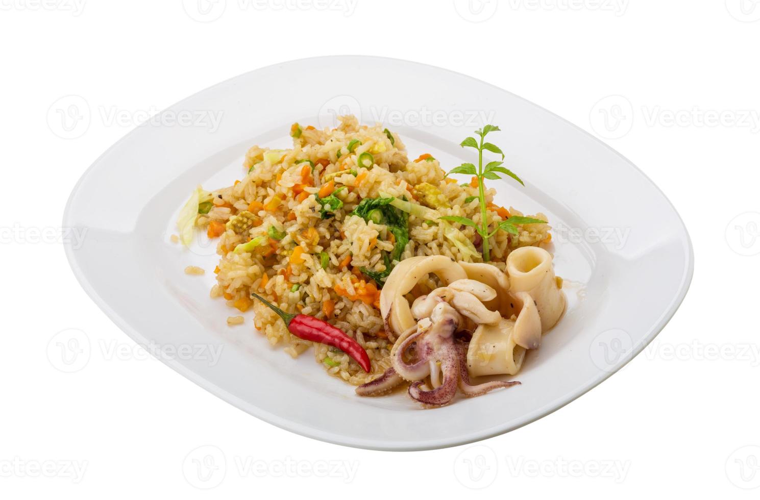 Fried rice with calamari on the plate and white background photo