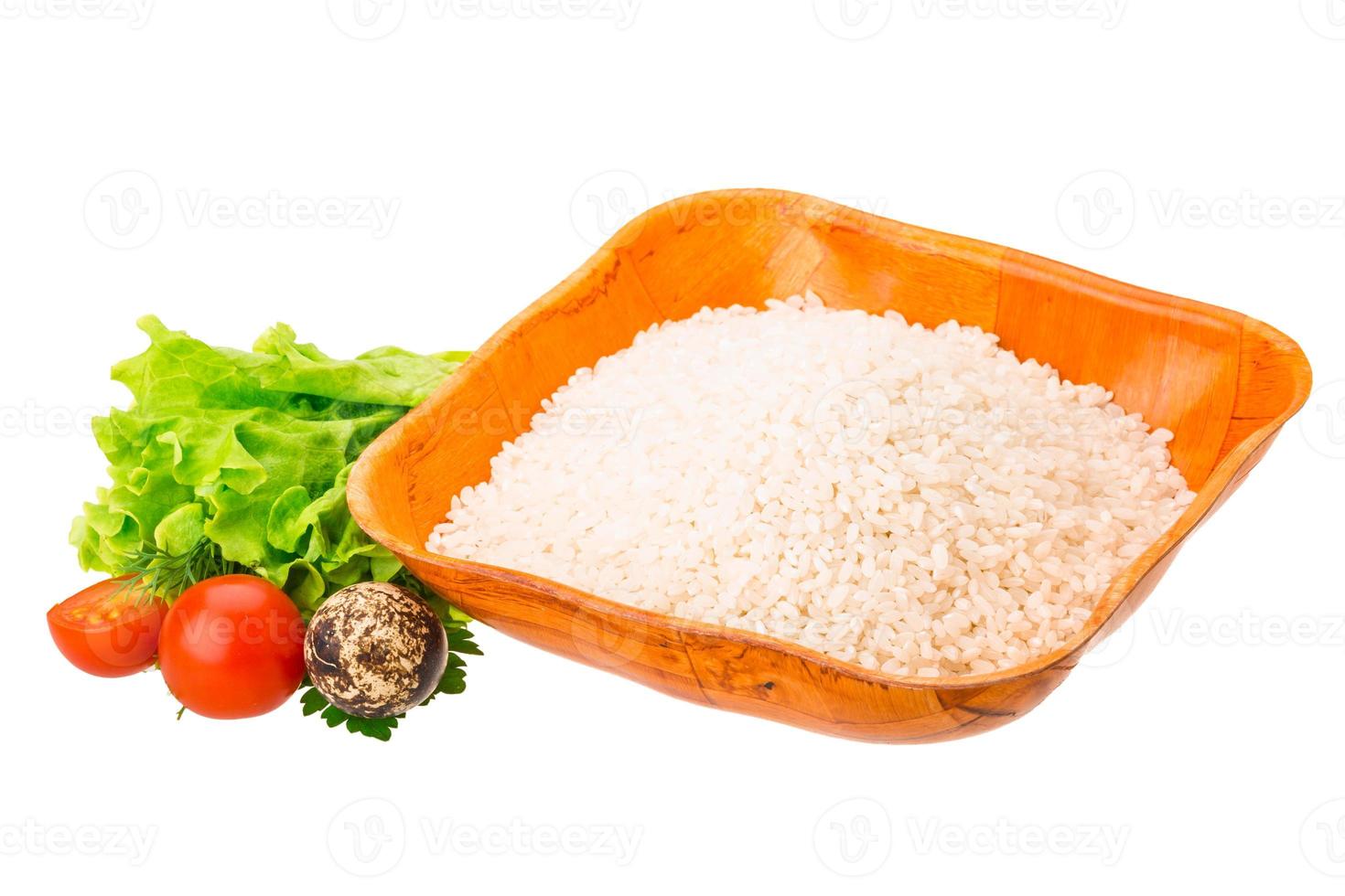 Rice in a bowl on white background photo