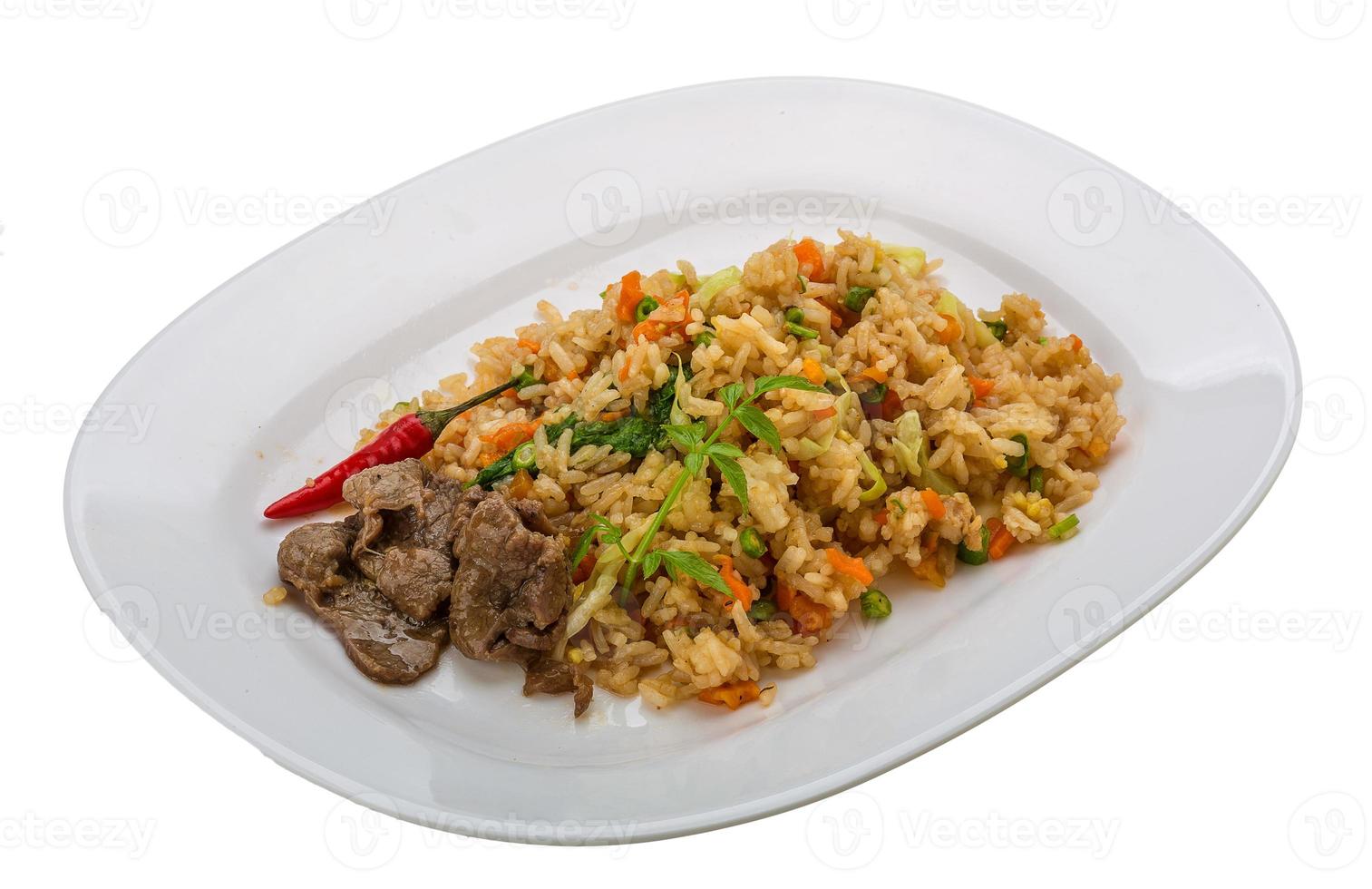 Fried rice with beef on the plate and white background photo