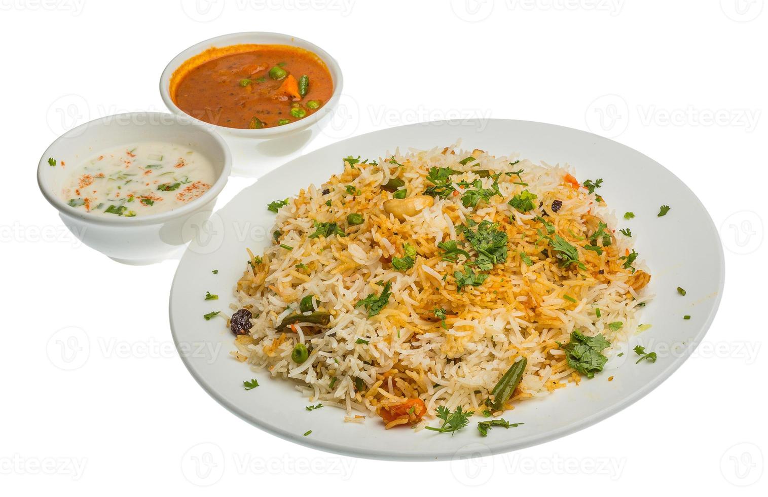 Vigetable Briyani on the plate and white background photo