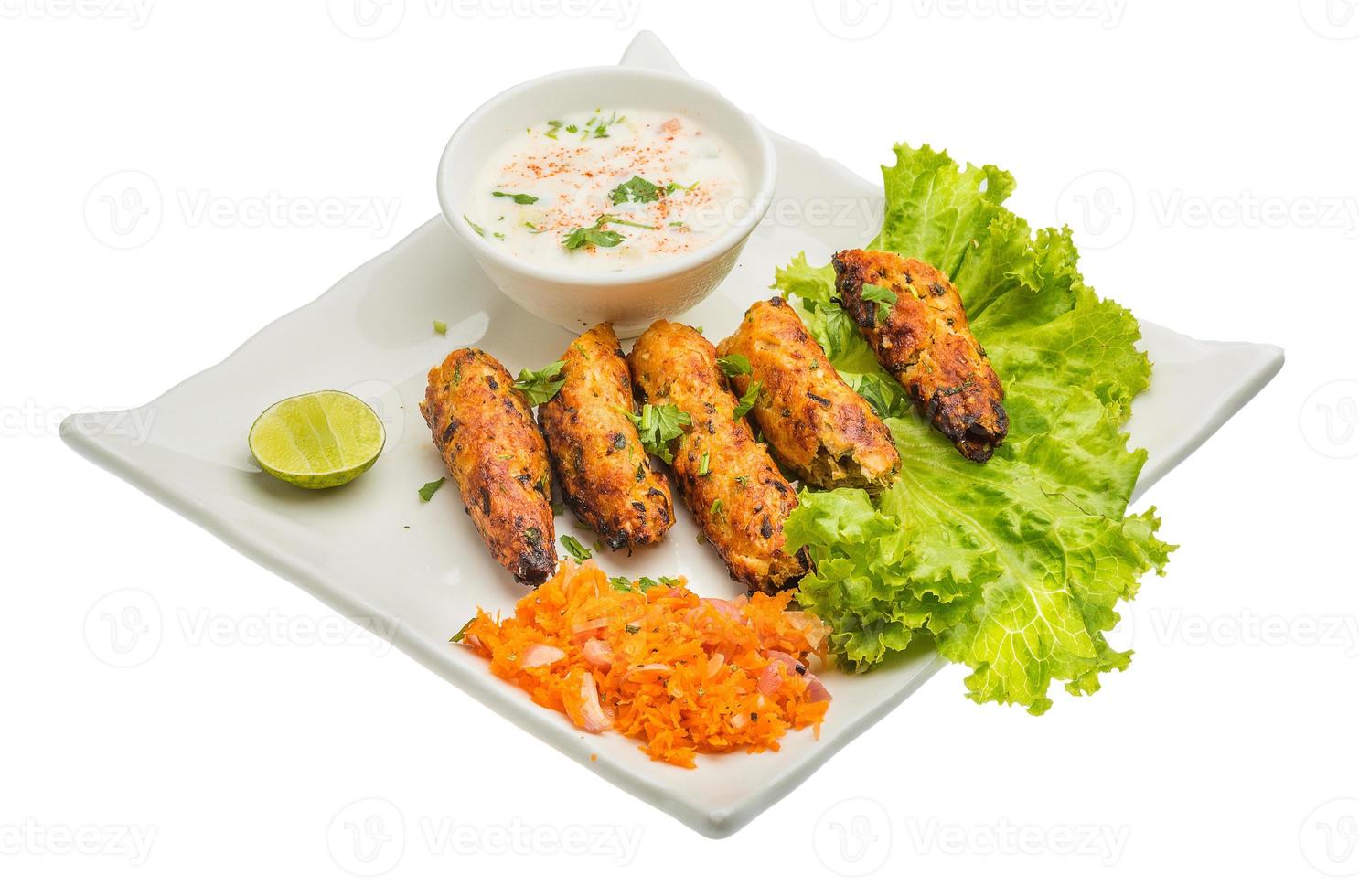 Shish kebab on the plate and white background photo