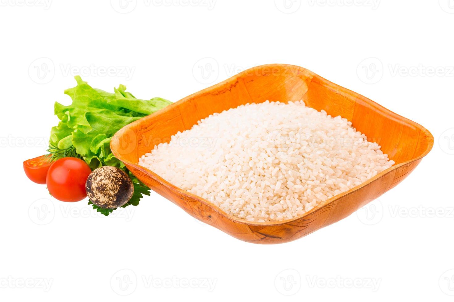 Rice in a bowl on white background photo