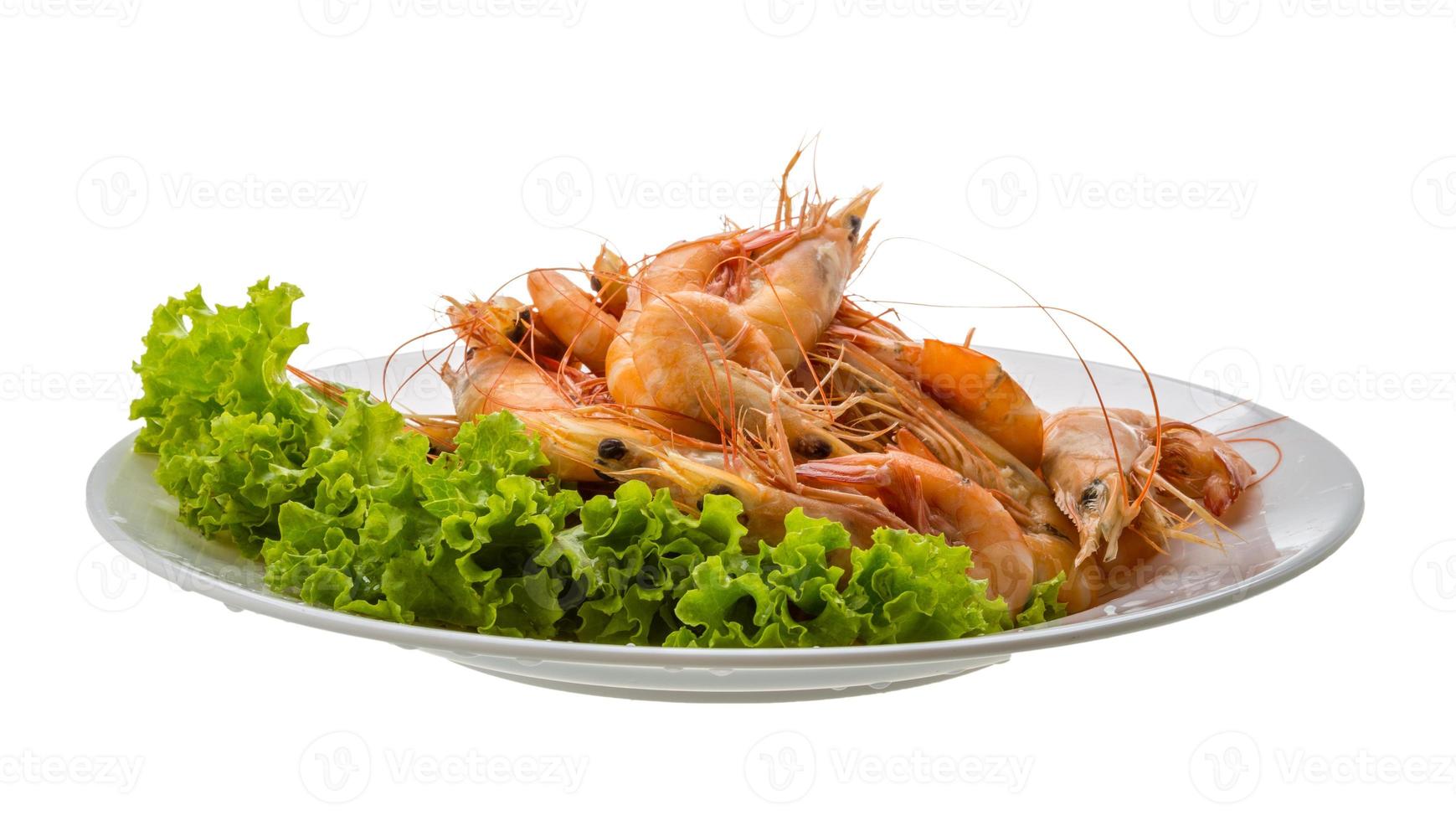 Big tiger shrimps on the plate and white background photo