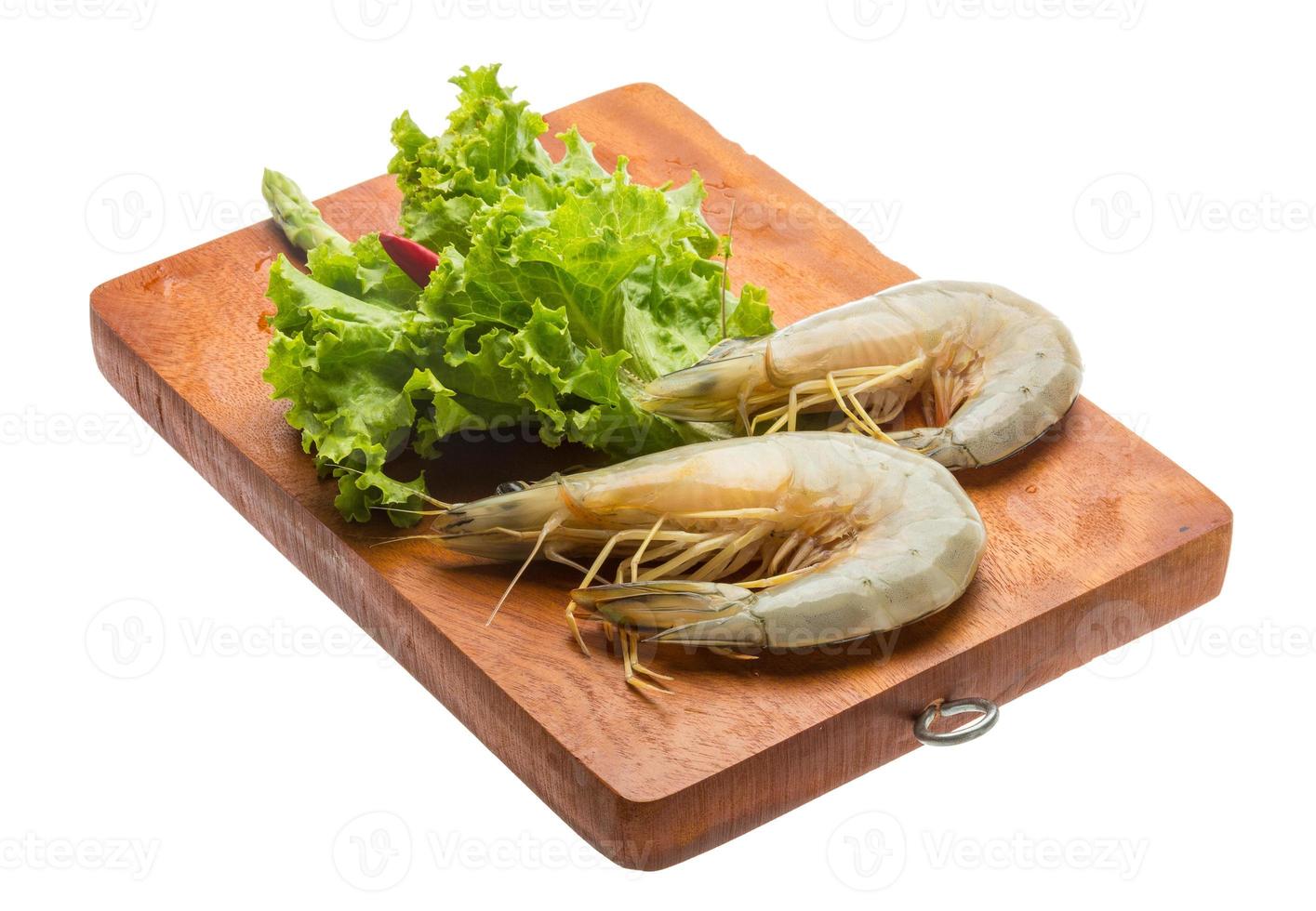 Tiger prawn on wooden board and white background photo