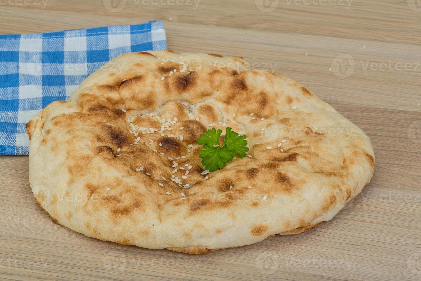 Armenian bread on wooden background photo